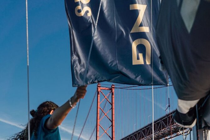 4 Hours Private Swimming/Sailing Tour on Sailboat in Lisbon Beach - The 25th of April Bridge overhead