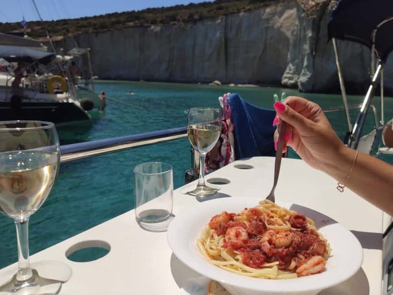 Adamantas: Kleftiko Sailing Cruise with Meal and Swim Stops - Lunch, ouzo, and Greek island hospitality