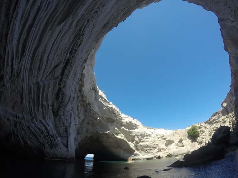Adamantas: Kleftiko Sailing Cruise with Meal and Swim Stops - Returning past Milos in the afternoon light