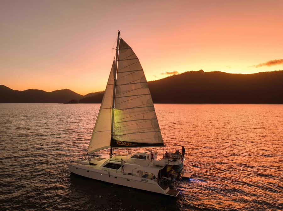 Airlie Beach: BYOB Sunset Sail in Style Catamaran Cruise - Pioneer Bay at sunset