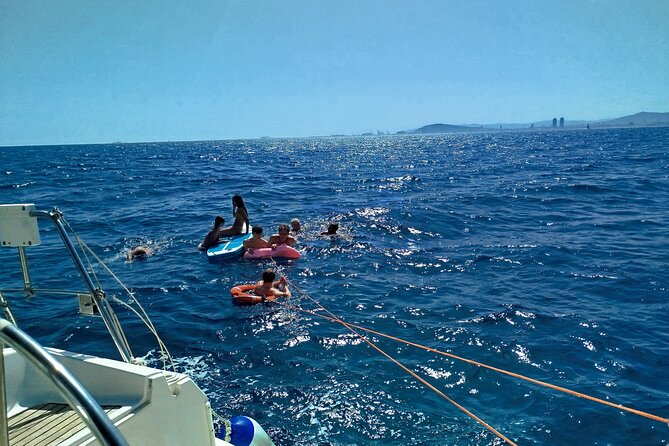 Barcelona Badalona Sailboat Tour Snack Drinks Swimming Sunset - Paddleboarding and the optional swimming break