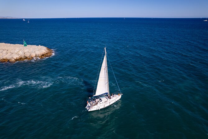 Barcelona Badalona Sailboat Tour Snack Drinks Swimming Sunset - What the two-hour route feels like