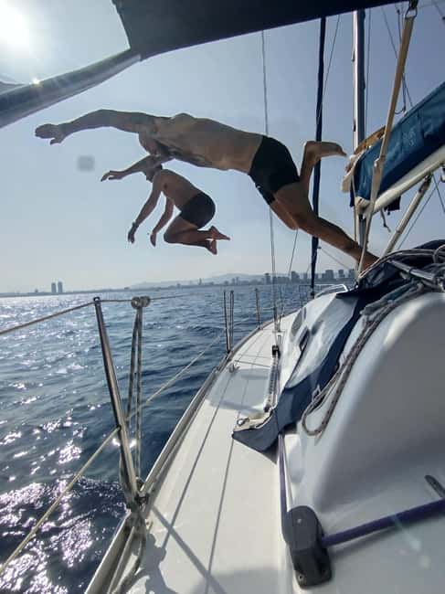 Barcelona Badalona : Sailboat Tour, Snacks, Drinks, Swimming - Swimming and paddleboarding when conditions cooperate