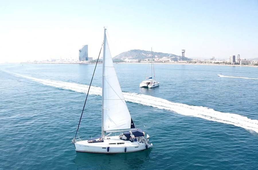 Barcelona: Boat trip with cava in amazing sailboat - W Barcelona and the Old City from offshore