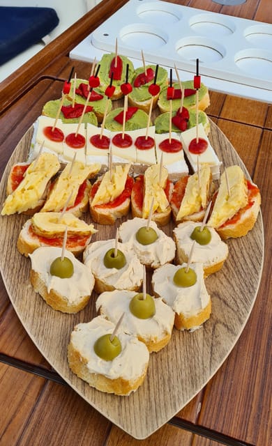 Barcelona: Sailing Tour with Spanish Tapas and Drinks - Leaving Barcelona from Port Olímpic