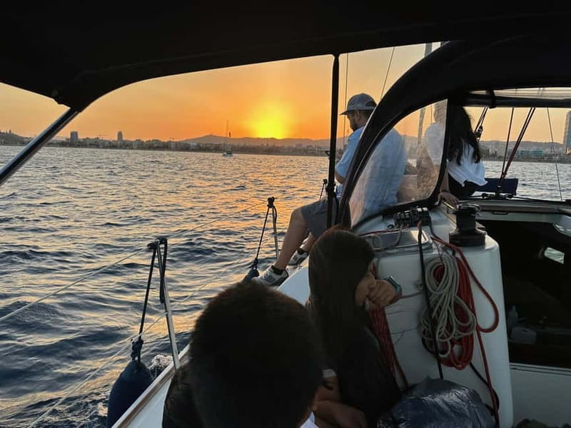 Barcelona: Sunset Sailboat Cruise with Open Bar and Snacks - Barceloneta Beach and the main sunset hour