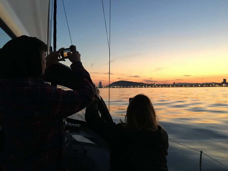Barcelona: Sunset Sailboat Cruise with Open Bar and Snacks - Cava, music, photographs, and the captain’s touch