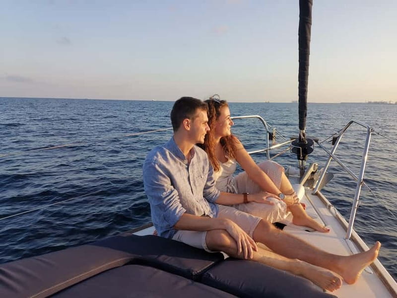 Barcelona: Sunset Sailboat Cruise with Open Bar and Snacks - Returning through the port