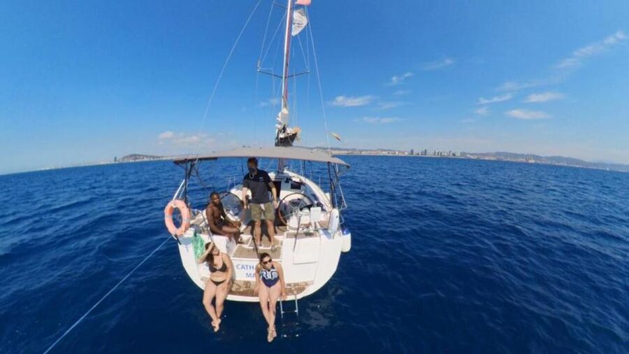 Barcelona: Sunset Sailing Experience with Snacks and Cava - Jumping into the Mediterranean