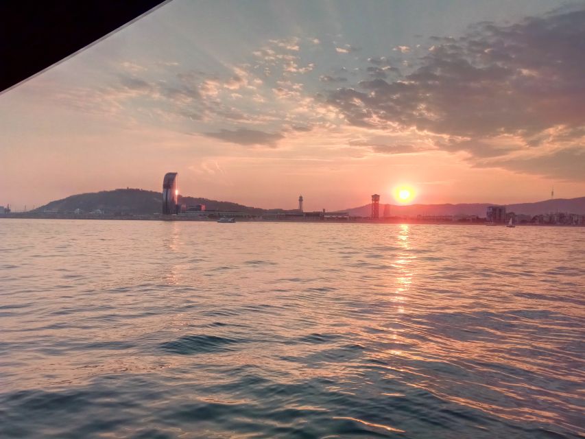 Barcelona: Sunset Sailing Tour with Open Bar & Snacks - Port Olímpic’s golden fish and twin towers