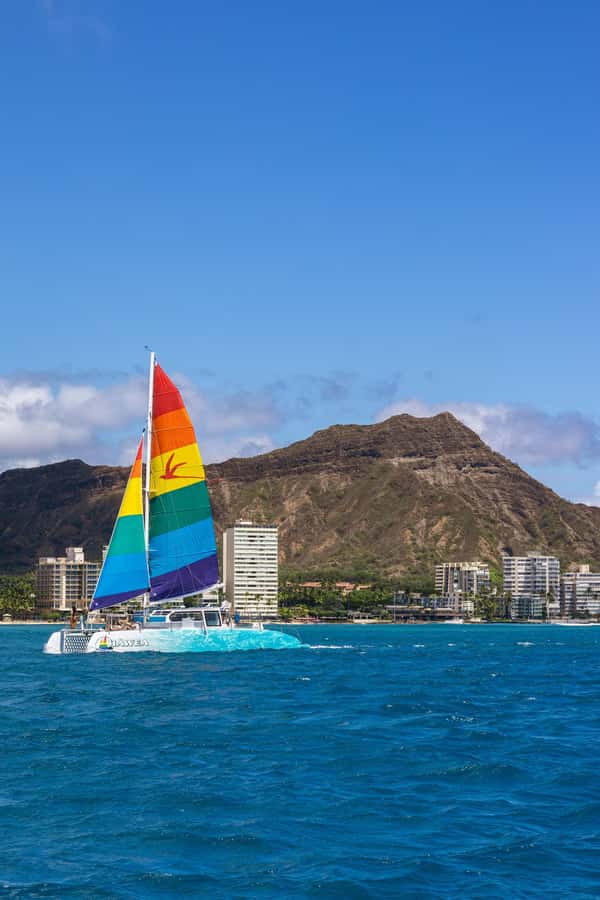 Board from Waikiki Beach for our Aloha Hour Sail - Starting behind the Duke Kahanamoku Statue