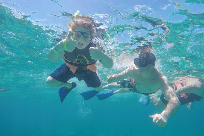 Cancun Half-Day Sailing Catamaran Cruise to Isla Mujeres - Snacks, drinks, and the changing island plan
