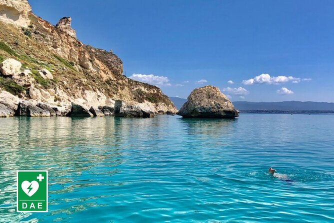 Catamaran tour stops bathing and snorkeling toast with prosecco - The first views: Cagliari’s port and city monuments