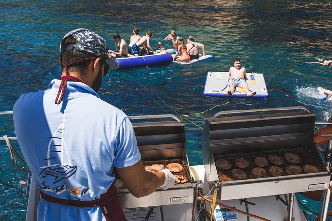 Catamaran trip with other groups along the Costa Brava. Saturday. - Eating a barbecue lunch on board