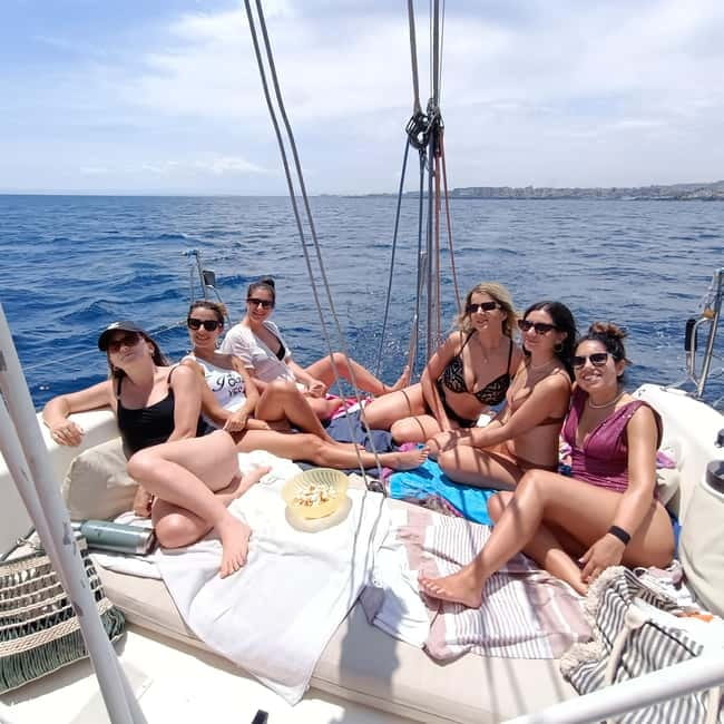 Catania: Coastline Sailing Tour with Aperitif - Aci Castello and its cliffside castle