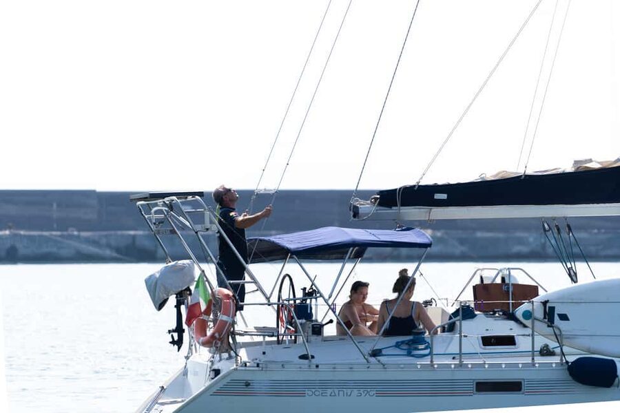 Catania: Sunset Sailing Tour with Sicilian Aperitif - The stop near Ulysses’ Cave
