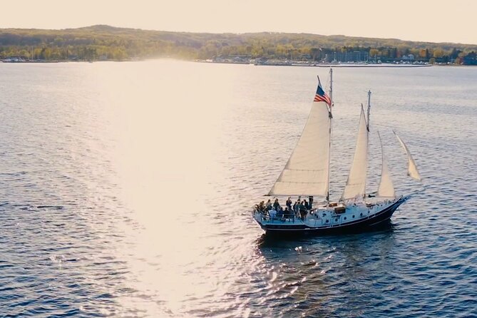 Day Sail from Traverse City with Food, Wine, & Cocktails - Helping with the sails and trying the helm