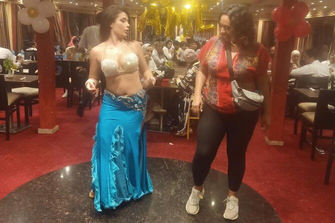 Dinner Nile Cruise belly dancer open buffer tanora show sailing on Nile - Boarding the Dinner Boat