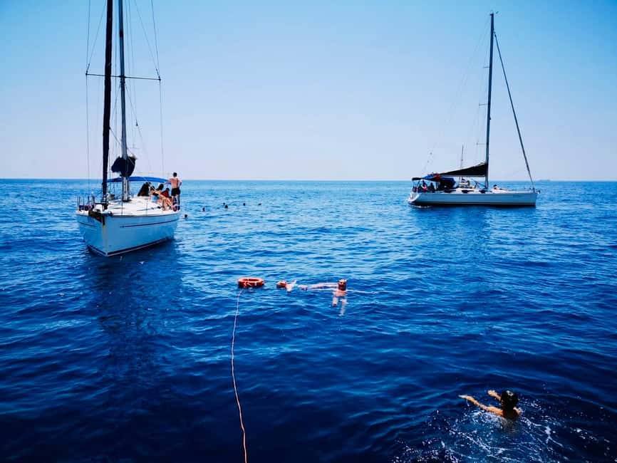 Discover the magic of sailing: a boat tour in Catania - Reaching the Ulysses Caves by boat