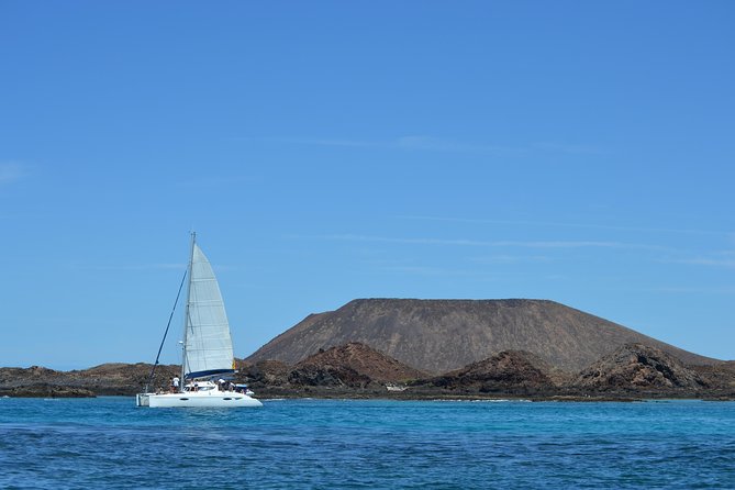 Exclusive Sailing Catamaran Experience to Lobos Island with lunch - Weather, Cancellation, and Practical Details