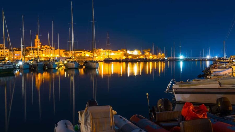 From Alghero: sunset on a sailing boat with aperitif - Watching Capo Caccia turn gold