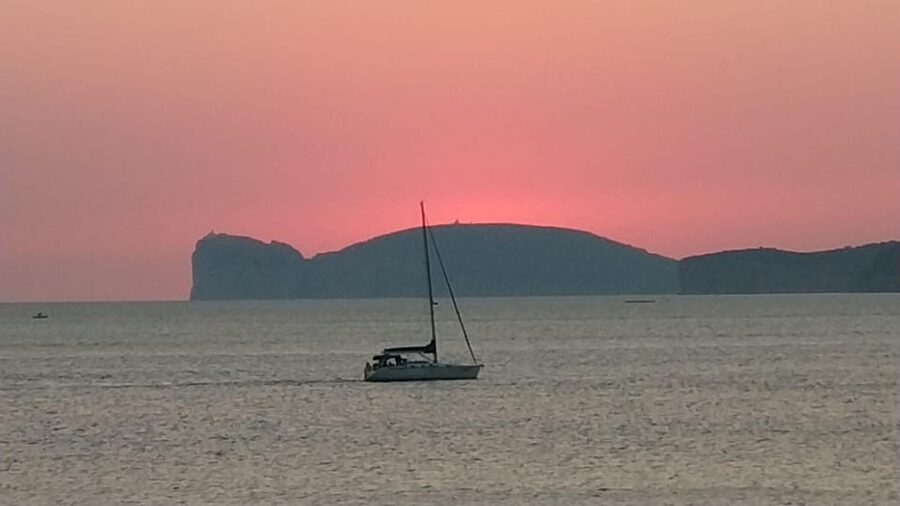From Alghero: sunset on a sailing boat with aperitif - Swimming beneath the evening sky