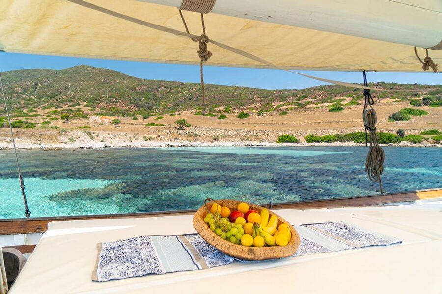 From Stintino: Asinara Vintage Sailing Boat Tour with Lunch - The final swim at Cala del Bianco