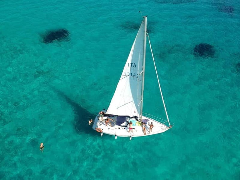 From Stintino: Half-Day Sailing Boat Tour to La Pelosa - Two swimming stops, with time to enjoy them