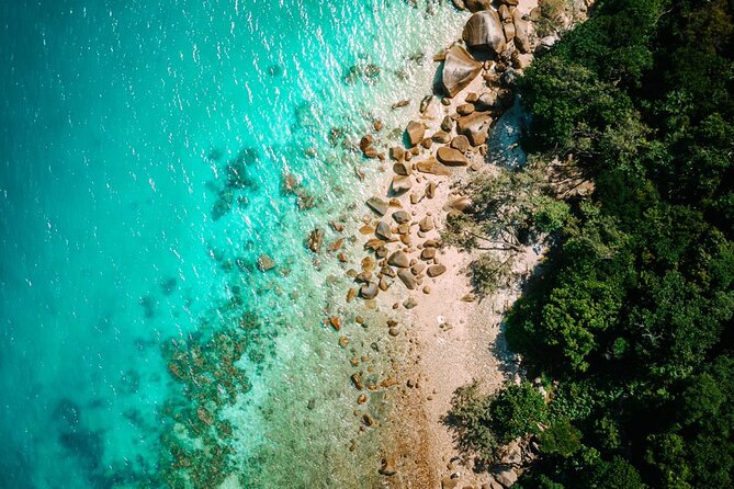 Full-Day Great Barrier Reef Sailing Trip from Cairns - Equipment, exposure suits, and older swimmers