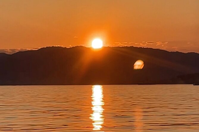 Golf Juan: Sunset Sailing Cruise with aperitif at the Island - Music, stories, and the mood on board