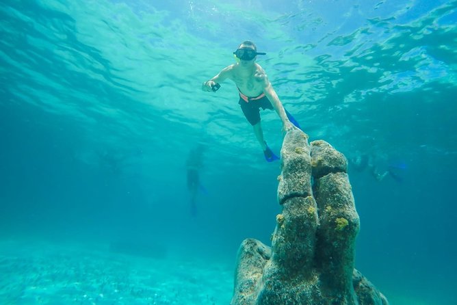 Half Day Sailing Private Catamaran to Isla Mujeres - Drinks, music, and the feel on board