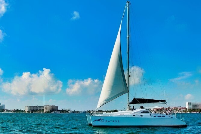 Isla Mujeres Catamaran Sailing Experience with Lunch & Open Bar - Beach-club time, lunch, and the open-bar question