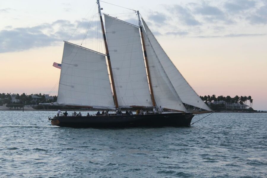 Key West: Schooner Full Moon Night Sail with Drinks - Boarding America 2.0 behind Schooner Wharf Bar