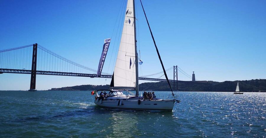 Lisbon: 2-Hour Sailing Yacht Cruise & Guided Tour w/2 drinks - Under the 25 de Abril Bridge