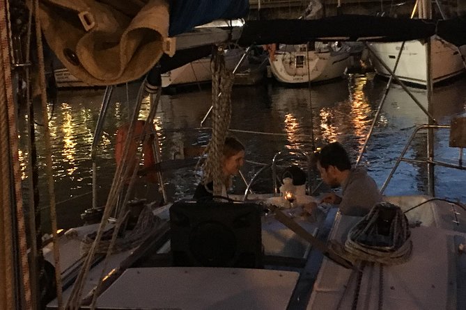 Lisbon by Night Sailing Tour with White or Rosé Wine & Light Snacks - Under the 25 de Abril Bridge