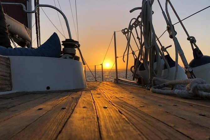 Lisbon: Daylight or Sunset on a Vintage Sailboat - The 25 de Abril Bridge and Christ the King
