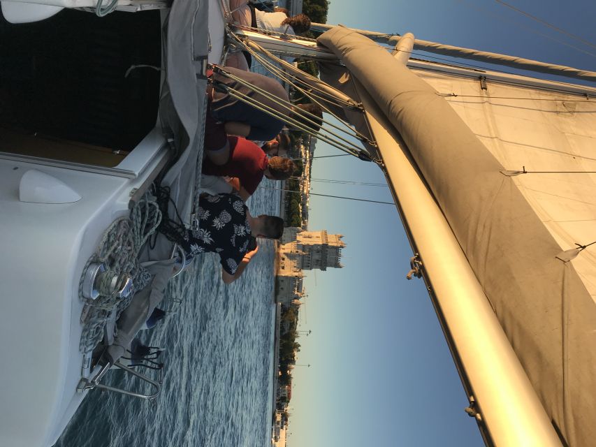 Lisbon Sunset Sailing – Small Group (max 10) Wine & History - Setting out under the bridge