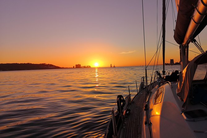 Lisbon Sunset Sailing Tour on Luxury Sailing Yacht with 2 Drinks - What the crew adds to the experience