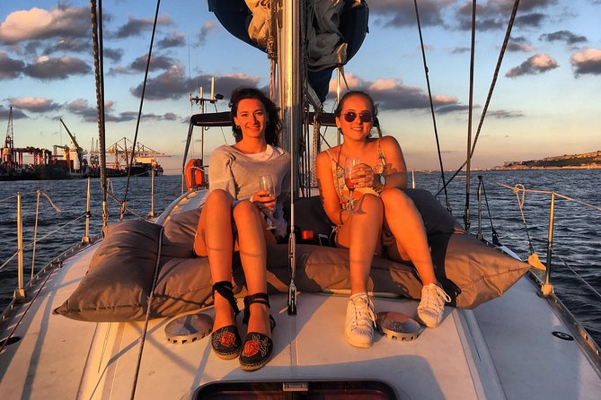 Lisbon Sunset Sailing Tour with White or Rosé Wine and Snacks - Wine, cheese, chouriço, and the real food expectations