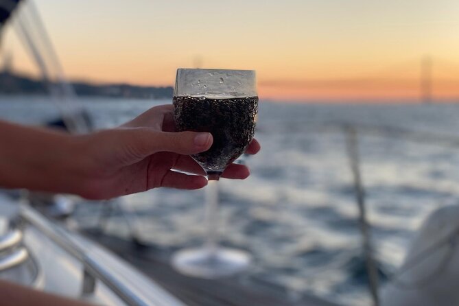 Lisbon: Sunset Sailing with Local Wine & Stunning Views - Belém Tower and the waterfront defenses