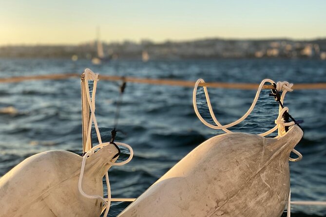 Lisbon: Sunset Sailing with Local Wine & Stunning Views - Sailing below the 25 de Abril Bridge