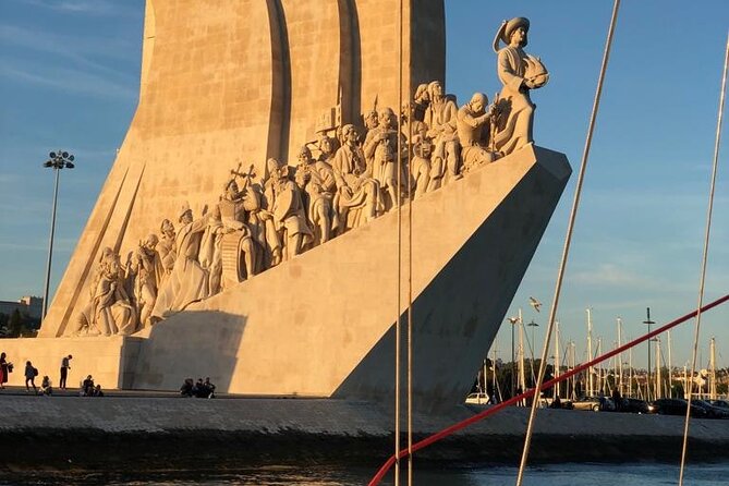 Lisbon: Sunset Sailing with Portuguese Wine and History - Cristo Rei across the Tagus
