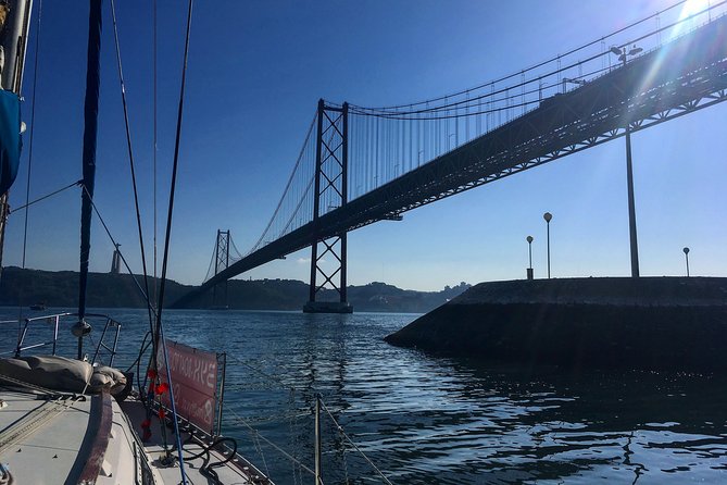 Lisbon Sunset Sensations on a Private Sailing Boat with wine&snacks - Cristo Rei across the river