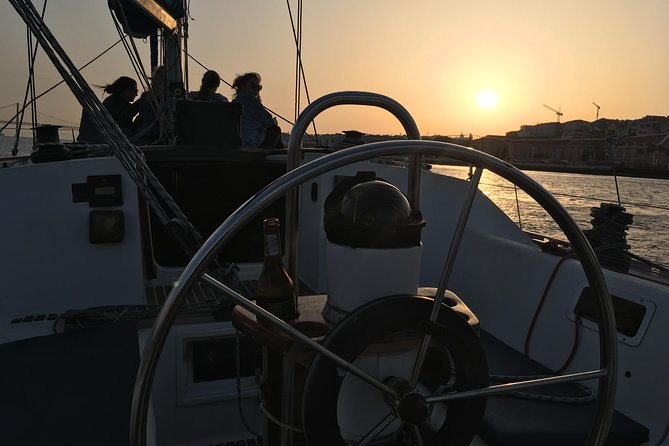 Lisbon Sunset Sensations on a Private Sailing Boat with wine&snacks - Crossing beneath the 25 de Abril Bridge