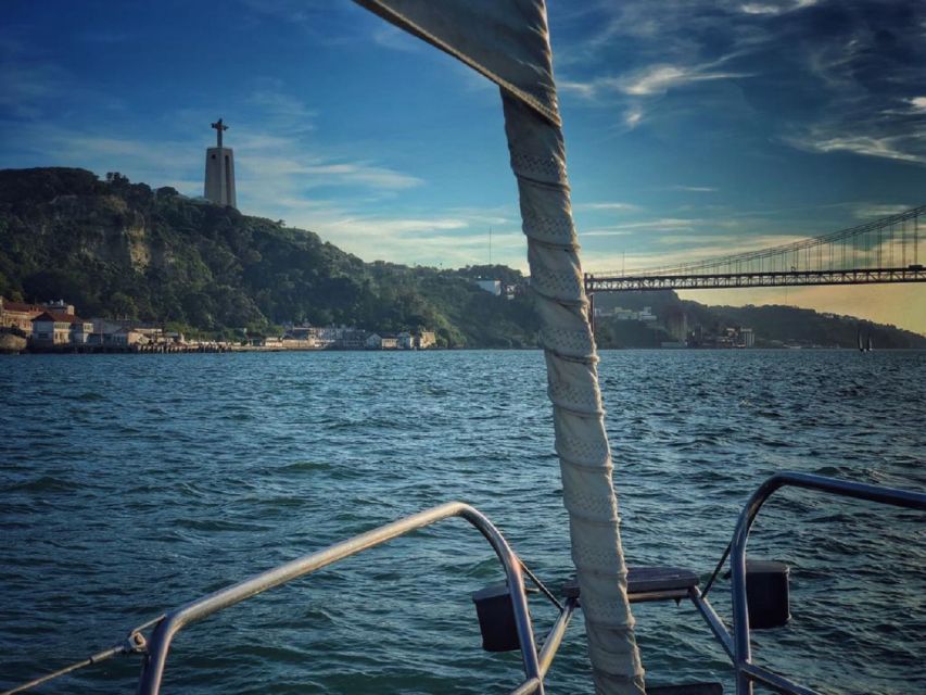 Lisbon: Yacht Sailing Tour With Portuguese Wine and History - Languages, crew, and what the reviews reveal