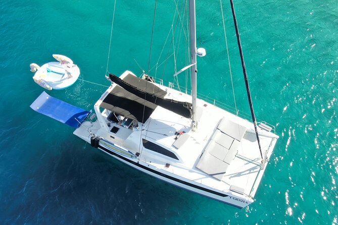 Luxury Sailing catamaran charter in Cabo San Lucas all inclusive - Paddle boards, floating mats, and easy water time