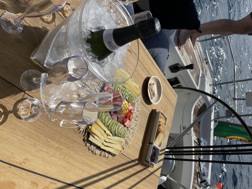 Madeira: Luxury Yacht & Sailing Sunset Tour - Leaving Funchal Marina on a blue-hulled yacht