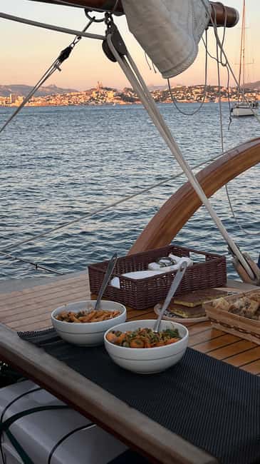 Marseille: Evening sailboat trip to the Calanques du Frioul with buffet and organic wine - Sailing Out Through Marseille Harbor