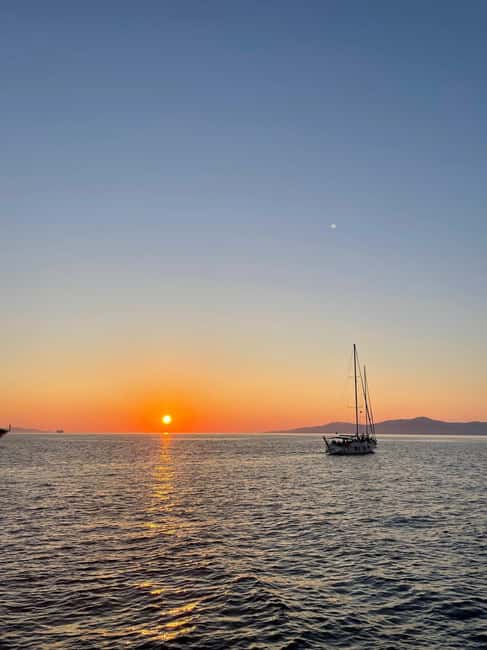 Mykonos: Sunset Sail Cruise to Rhenia, Beach Hopping, Dinner - Greek food, wine, and an early dinner
