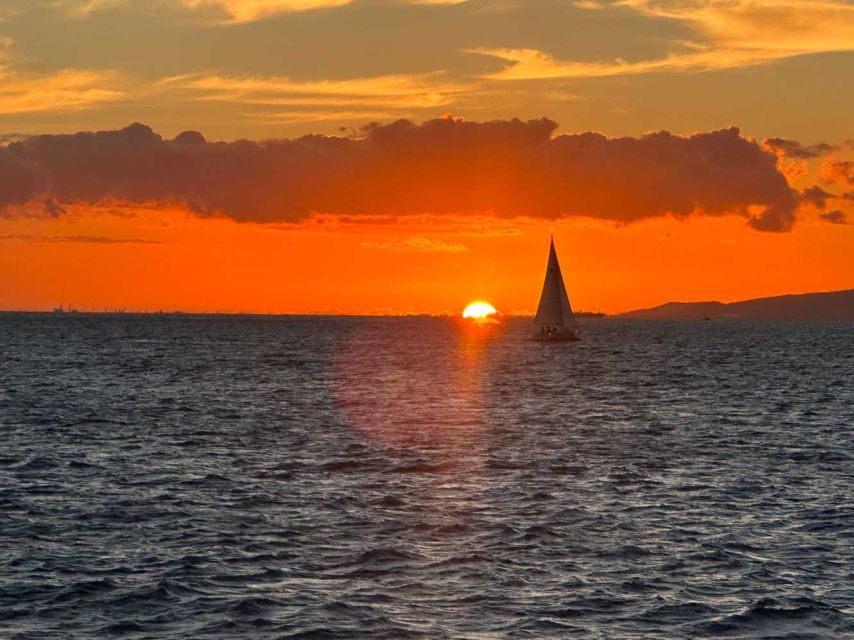 Oahu: Sunset sailing in small intimate groups - Honolulu lights from the water
